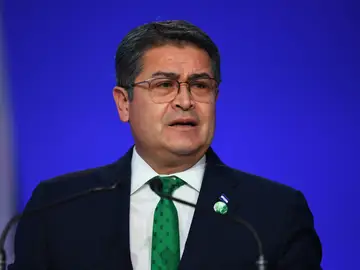 Honduras-US-Ex-President-Pardon FILE - Honduras' President Juan Orlando Hernandez speaks during the opening ceremony of the UN Climate Change Conference COP26 in Glasgow, Scotland, Monday Nov. 1, 2021. Andy Buchanan/Pool via AP, File)
