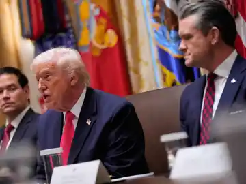 Trump President Donald Trump speaks during a cabinet meeting at the White House, Tuesday, Dec. 2, 2025, in Washington, as Secretary of State Marco Rubio and Defense Secretary Pete Hegseth, look on. (AP Photo/Julia Demaree Nikhinson)