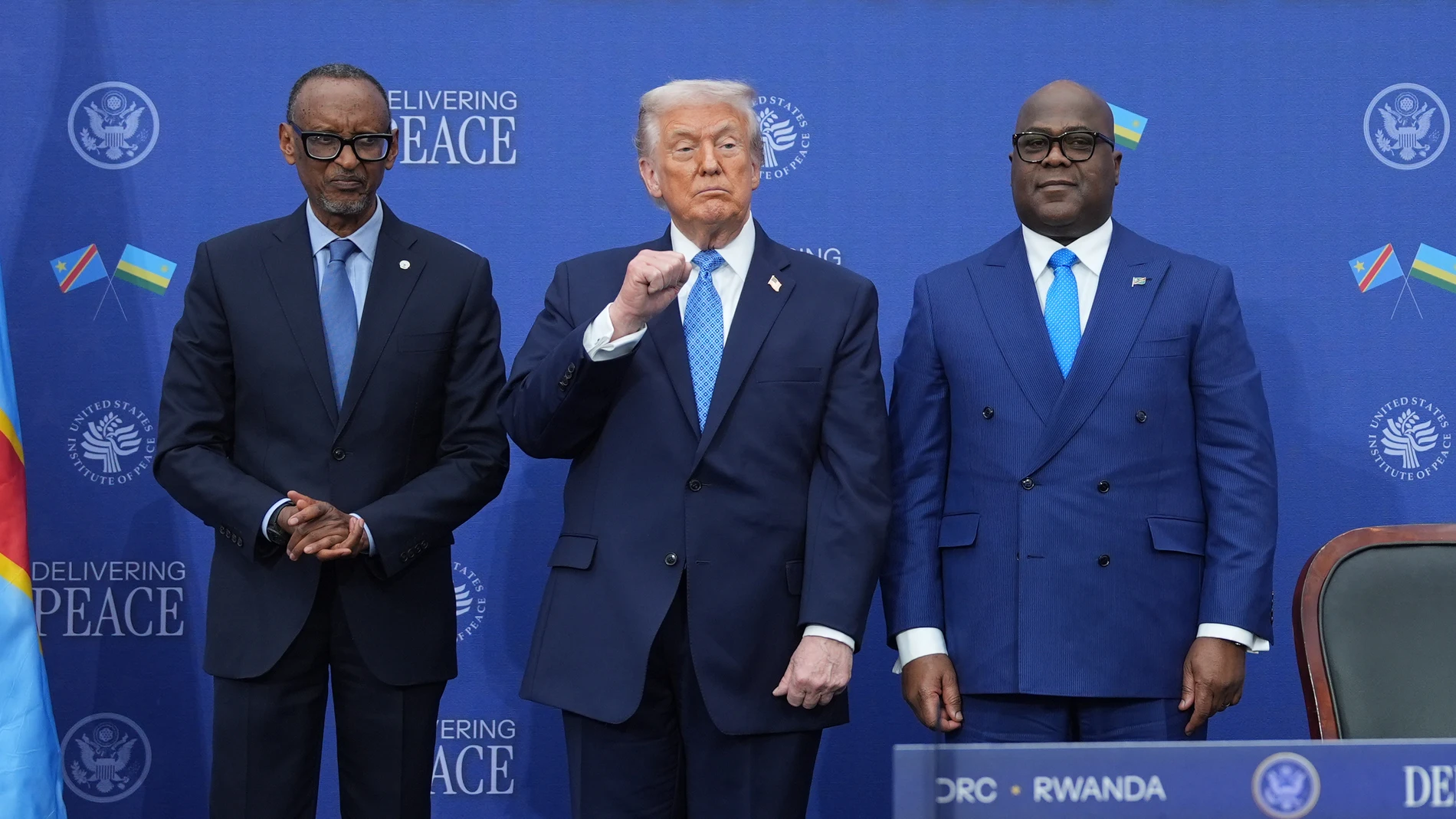 President Donald Trump stands with Rwanda's President Paul Kagame and Democratic Republic of Congo President Felix-Antoine Tshisekedi at the Donald J. Trump Institute of Peace, Thursday, Dec. 4, 2025, in Washington. (AP Photo/Evan Vucci)