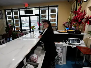 Federal Enforcement New Orleans Carmela Diaz poses inside her closed restaurant in the midst of a Customs and Border Protection immigration crackdown in Kenner, La., Thursday, Dec. 4, 2025. (AP Photo/Gerald Herbert)