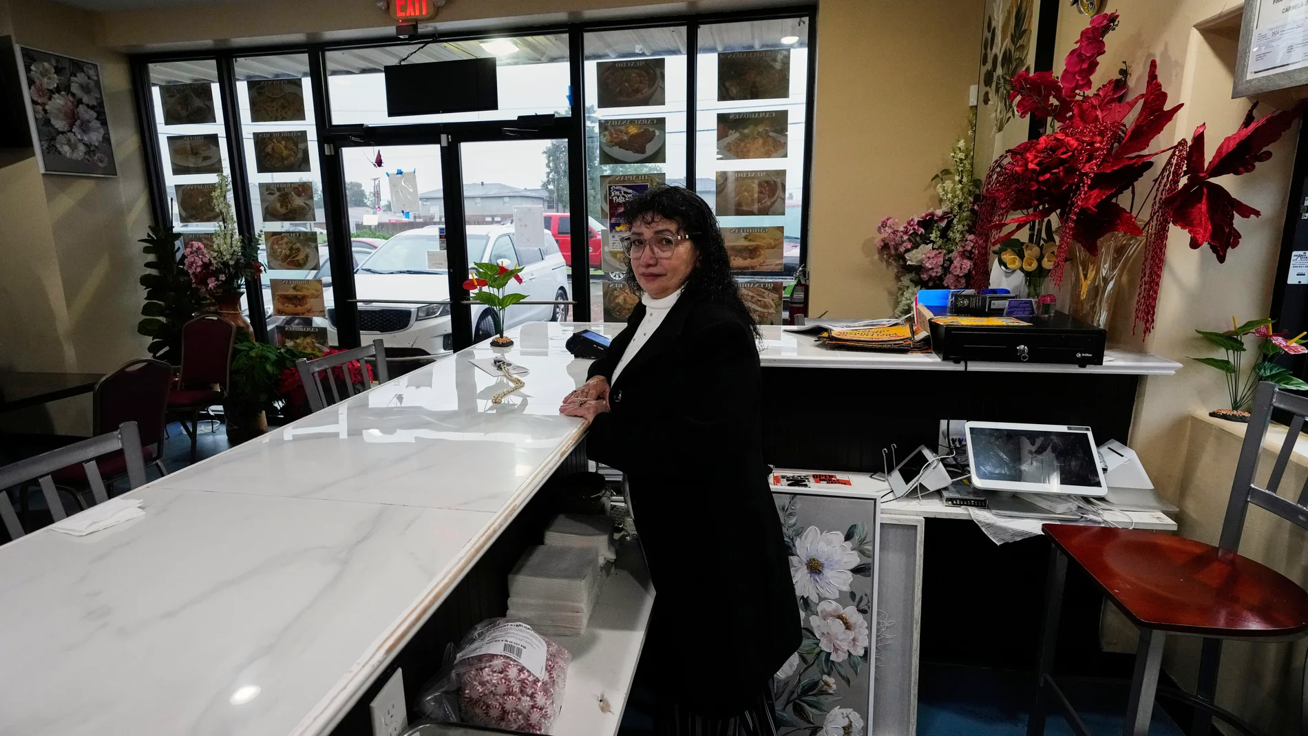 Carmela Diaz poses inside her closed restaurant in the midst of a Customs and Border Protection immigration crackdown in Kenner, La., Thursday, Dec. 4, 2025. (AP Photo/Gerald Herbert)