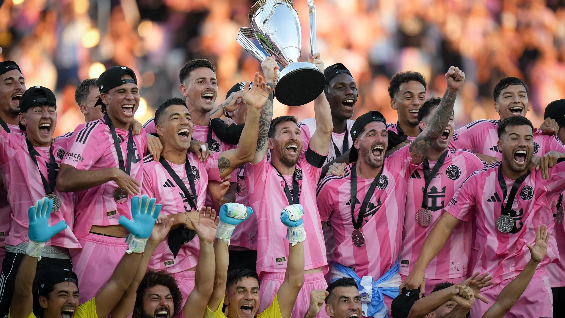 Inter Miami's Lionel Messi hoists the trophy alongside teammates after defeating the Vancouver Whitecaps in the MLS Cup final soccer match, in Fort Lauderdale, Fla., Saturday, Dec. 6, 2025. (Darryl Dyck/The Canadian Press via AP)
