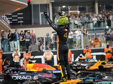 Abu Dhabi F1 GP Auto Racing McLaren driver Lando Norris of Britain celebrates after becomin a rold champion after the Abu Dhabi Formula One Grand Prix in Abu Dhabi, United Arab Emirates, Sunday, Dec. 7, 2025. (AP Photo/Darko Bandic)
