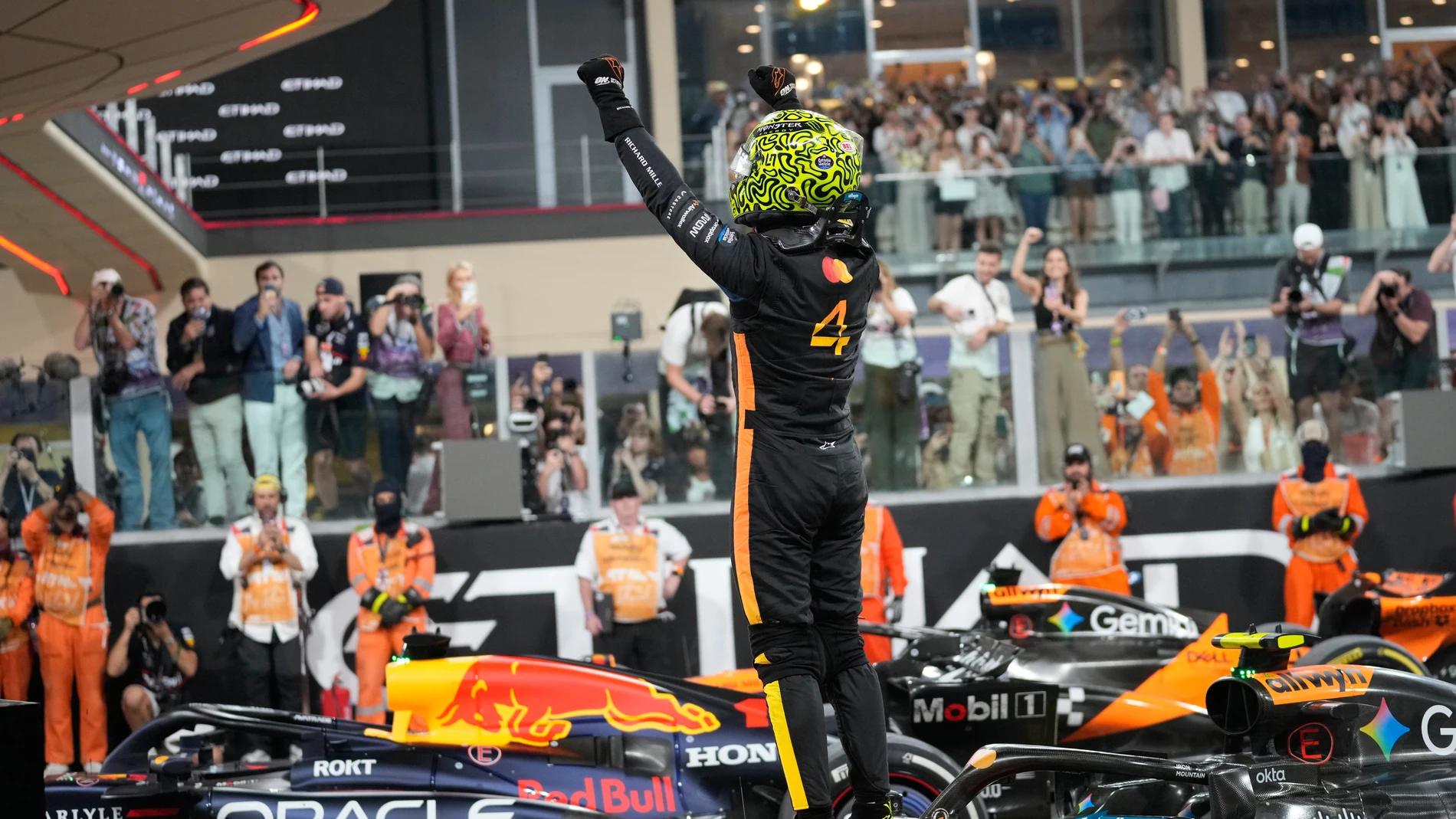 McLaren driver Lando Norris of Britain celebrates after becomin a rold champion after the Abu Dhabi Formula One Grand Prix in Abu Dhabi, United Arab Emirates, Sunday, Dec. 7, 2025. (AP Photo/Darko Bandic)