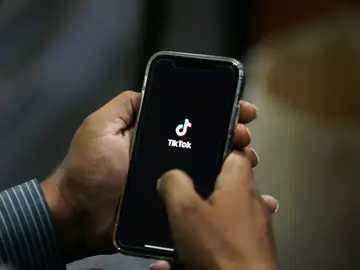Pakistan-Social Media FILE - In this July 21, 2020 file photo, a man opens social media app 'TikTok' on his cell phone, in Islamabad, Pakistan. (AP Photo/Anjum Naveed, File)