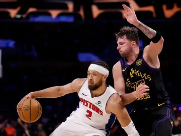 Pistons Lakers Basketball Detroit Pistons guard Cade Cunningham (2) looks to pass the ball while being guarded by Los Angeles Lakers guard Luka Doncic (77) during the first half of an NBA basketball game Tuesday, Dec. 30, 2025, in Los Angeles. (AP Photo/Caroline Brehman)