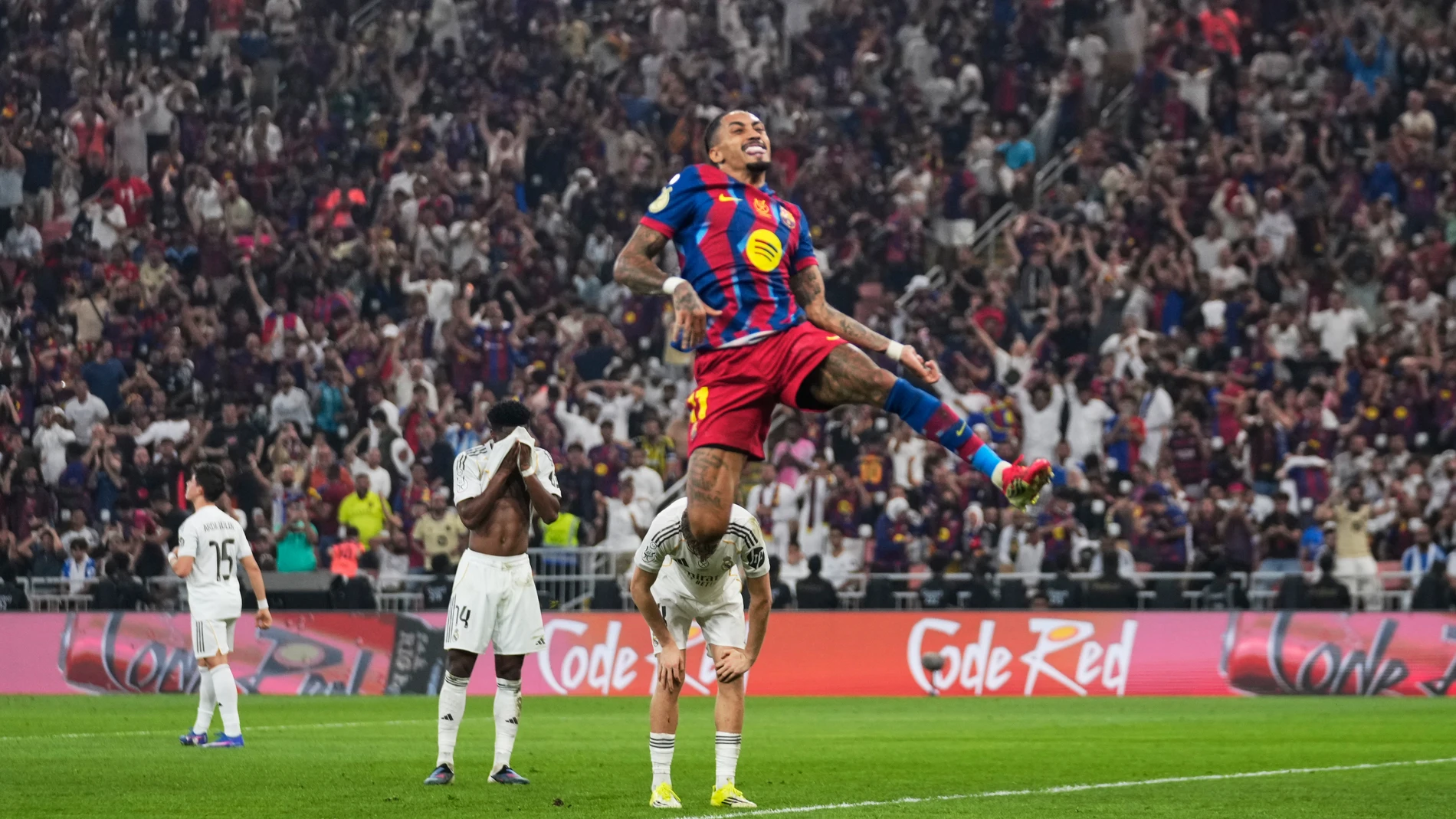 Barcelona's Raphinha celebrates after scoring his second goal during the Spanish Super Cup final soccer match against Real Madrid at King Abdullah Sports City Stadium in Jeddah, Saudi Arabia, Sunday, Jan. 11, 2026. (AP Photo/Altaf Qadri)