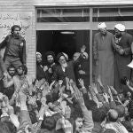  In this Feb. 1, 1979 file photo, Ayatollah Ruhollah Khomeini, center, waves to followers as he appears on the balcony of his headquarters in Tehran, Iran. Forty years ago, Iran's ruling shah left his nation for the last time and an Islamic Revolution overthrew the vestiges of his caretaker government. The effects of the 1979 revolution, including the takeover of the U.S. Embassy in Tehran and ensuing hostage crisis, reverberate through decades of tense relations between Iran and America. 