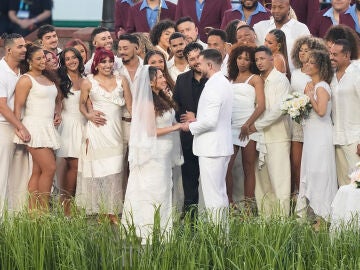 A couple dressed as a bride and groom participate in the Bad Bunny performance during halftime of the NFL Super Bowl 60 football game between the Seattle Seahawks and the New England Patriots, Sunday, Feb. 8, 2026, in Santa Clara, Calif. (AP Photo/Frank Franklin II)