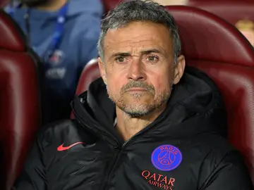 Monaco Champions League Soccer PSG's head coach Luis Enrique looks out from the bench prior to the first-leg of the Champions League playoff soccer match between Monaco and Paris Saint-Germain in Monaco, Tuesday, Feb. 17, 2026. (AP Photo/Philippe Magoni)