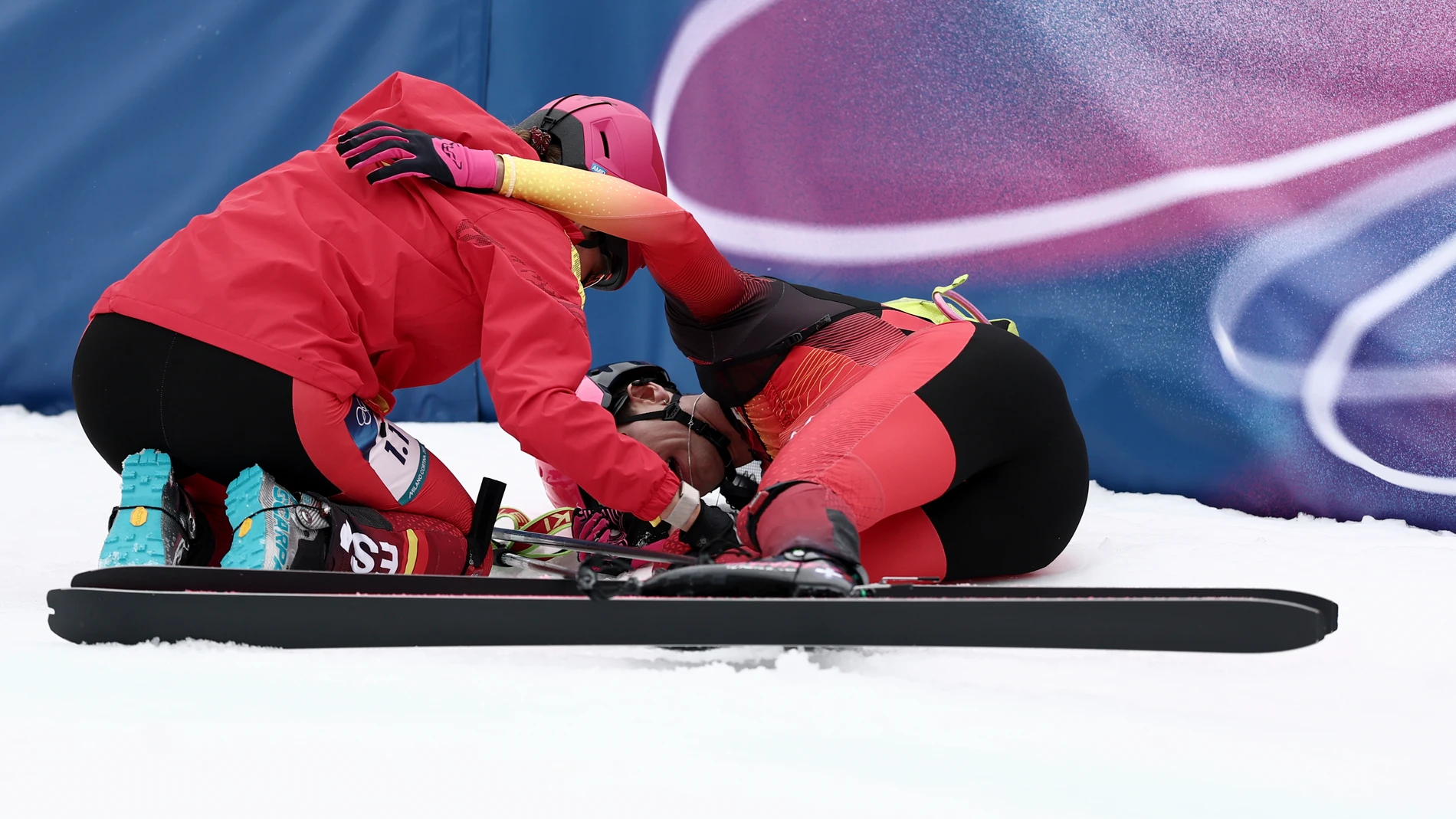Spain's Ana Alonso Rodriguez, left, celebrates winning bronze with Spain's Oriol Cardona Coll in a ski mountaineering mixed relay, at the 2026 Winter Olympics, in Bormio, Italy, Saturday, Feb. 21, 2026. (AP Photo/Gabriele Facciotti)