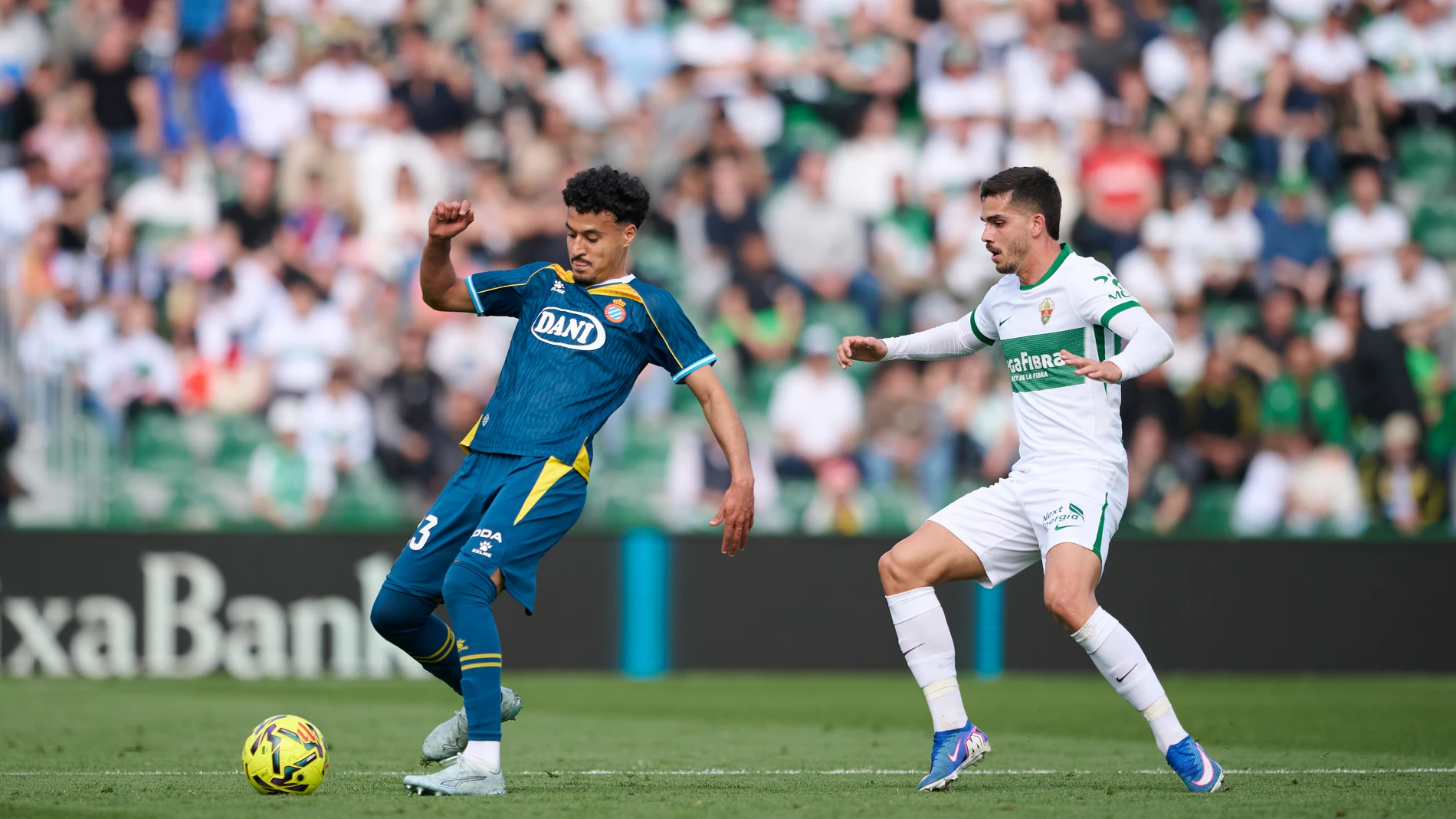 Omar El Hilali of RCD Espanyol competes for the ball with Andre Da Silva of Elche CF during the Spanish League, LaLiga EA Sports, football match played between Elche CF and RCD Espanyol at Estadio Manuel Martinez Valero on March 1, 2026 in Elche, Alicante, Spain. AFP7 01/03/2026 ONLY FOR USE IN SPAIN