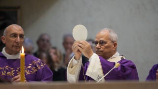 Pope Leo XIV, right, with his vicar for Rome Cardinal Baldo Reina, left, presides over Mass during his visit to the parish complex of Santa Maria della Presentazione on the outskirts of Rome, Sunday, March 8, 2026. (AP Photo/Gregorio Borgia)
