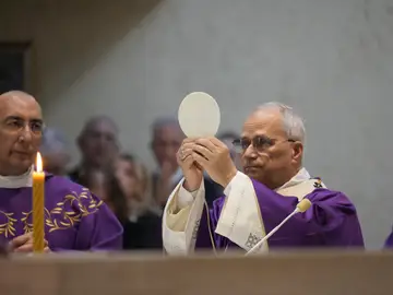 Vatican Pope Pope Leo XIV, right, with his vicar for Rome Cardinal Baldo Reina, left, presides over Mass during his visit to the parish complex of Santa Maria della Presentazione on the outskirts of Rome, Sunday, March 8, 2026. (AP Photo/Gregorio Borgia)