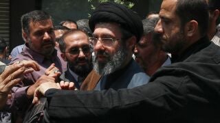 Mojtaba Khamenei, the son of Iran's Supreme Leader, Ayatollah Ali Khamenei, center, attends the annual Quds, or Jerusalem Day, rally in Tehran, Iran, May 31, 2019. (AP Photo/Vahid Salemi)