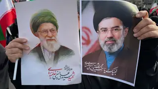 Iran US Israel A woman holds posters of Ayatollah Mojtaba Khamenei, right, the successor to his late father, Ayatollah Ali Khamenei, left, as supreme leader, during a rally supporting him in Tehran, Iran, Monday, March 9, 2026. (AP Photo/Vahid Salemi)