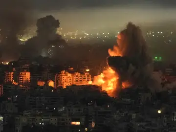 Lebanon Israel Iran Smoke and flames rise from buildings following an Israeli airstrike in Dahiyeh, Beirut's southern suburbs, Lebanon, Wednesday, March 11, 2026. (AP Photo/Bilal Hussein)