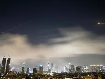 Israel US Iran Israeli air defense system fires to intercept missiles during an Iranian attack over Tel Aviv, Israel, early Sunday, March 15, 2026. (AP Photo/Ohad Zwigenberg)
