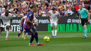 Spain La Liga Soccer Barcelona's Raphinha scores on a penalty kick during the Spanish La Liga soccer match between Barcelona and Sevilla in Barcelona, Spain, Sunday, March 15, 2026. (AP Photo/Joan Monfort)