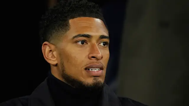 Britain Champions League Soccer Real Madrid's Jude Bellingham sits on the tribune during the Champions League round of 16 second leg soccer match between Manchester City and Real Madrid in Manchester, Tuesday, March 17, 2026. (AP Photo/Dave Thompson)