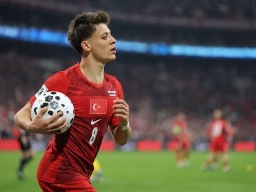Turkey's Arda Guler grabs the ball during the 2026 World Cup playoff semifinal soccer match between Turkey and Romania, in Istanbul, Turkey, Thursday, March 26, 2026. (AP Photo)