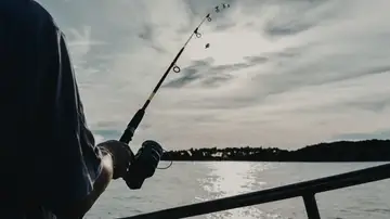 Imagen de archivo sobre una persona pescando Imagen de archivo sobre una persona pescando