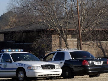FILE - Police cruisers are stationed outside the Arkansas State Medical Board building during a medical board meeting, Feb. 5, 2009, in Little Rock, Ark. (AP Photo/Mike Wintroath)