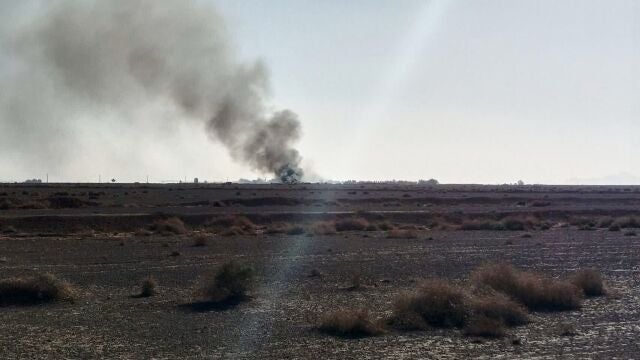In this image provided by Sepahnews, the Iranian Revolutionary Guard's official website, black smoke rises into the air at what Iran's state TV claimed was the site where an American transport plane and two helicopters involved in a rescue operation were shot down, in Isfahan province, Iran, April, 2026. (Sepahnews via AP)