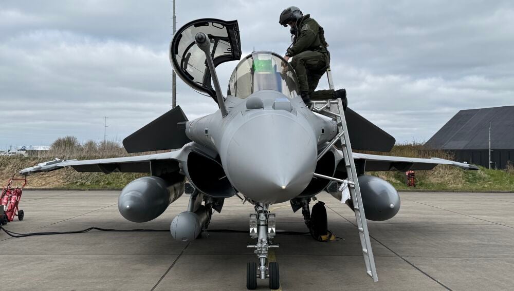 A French pilot climbs into a Rafale fighter jet at Leeuwarden airbase in the Netherlands during the NATO exercise "Ramstein Flag 25"