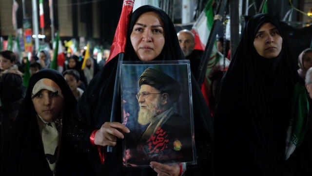 A pro-government demonstrator holds a picture of the late Iranian Supreme Leader Ayatollah Ali Khamenei, who was killed in the U.S. and Israel strikes on Feb. 28, during a gathering in Tehran, Iran, Saturday, April 11, 2026. (AP Photo/Vahid Salemi)