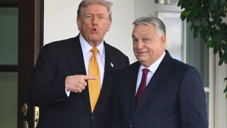 FILE - President Donald Trump, left, greets Hungary's Prime Minister Viktor Orban at the White House, Friday, Nov. 7, 2025, in Washington. (AP Photo/John McDonnell,File)
