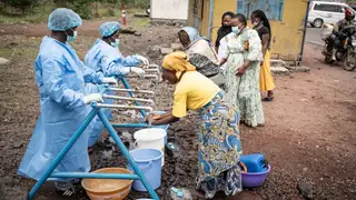 Prevention measures to contain the spread of Ebola in DR Congo KANYARUCHINYA (Congo, The Democratic Republic Of The), 27/05/2026.- Locals wash their hands at a checkpoint set up for preventive measures against the spread of Ebola in Kanyaruchinya, near Goma, North Kivu, Democratic Republic of Congo, 27 May 2026. The World Health Organization (WHO) has declared the Ebola outbreak, caused by the Bundibugyo virus, in the Democratic Republic of the Congo a public health emergency of international concern. EFE/EPA/MARIE JEANNE MUNYERENKANA