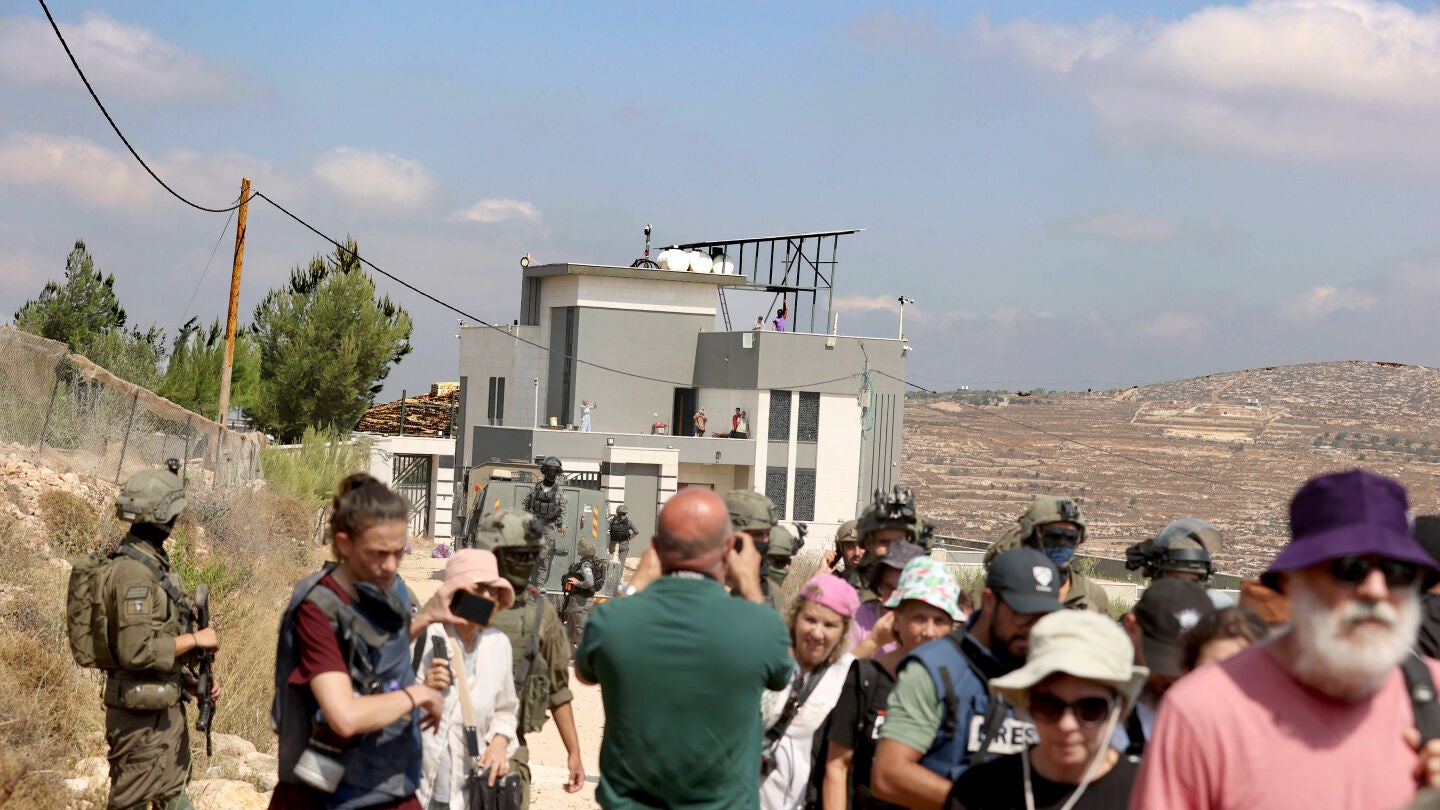 August 14, 2026, Nablus, West Bank, Palestine: Israeli, international left-wing activists and volunteers from other countries seen at the entrance of a Palestinian home besieged by Israeli settlers in the village of Qusra. Israeli forces attacked the settlers who surrounded the Palestinian homes amid unprecedentedly sharp criticism from the United States. The forces surrounded Palestinian homes in Qusra including one owned by an American citizen. Residents say they have been prevented from ac...