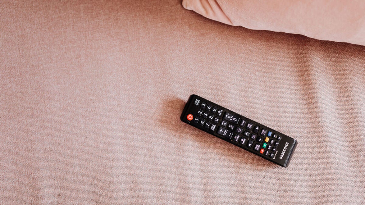 TV remote controls kept secure using simple Velcro strips