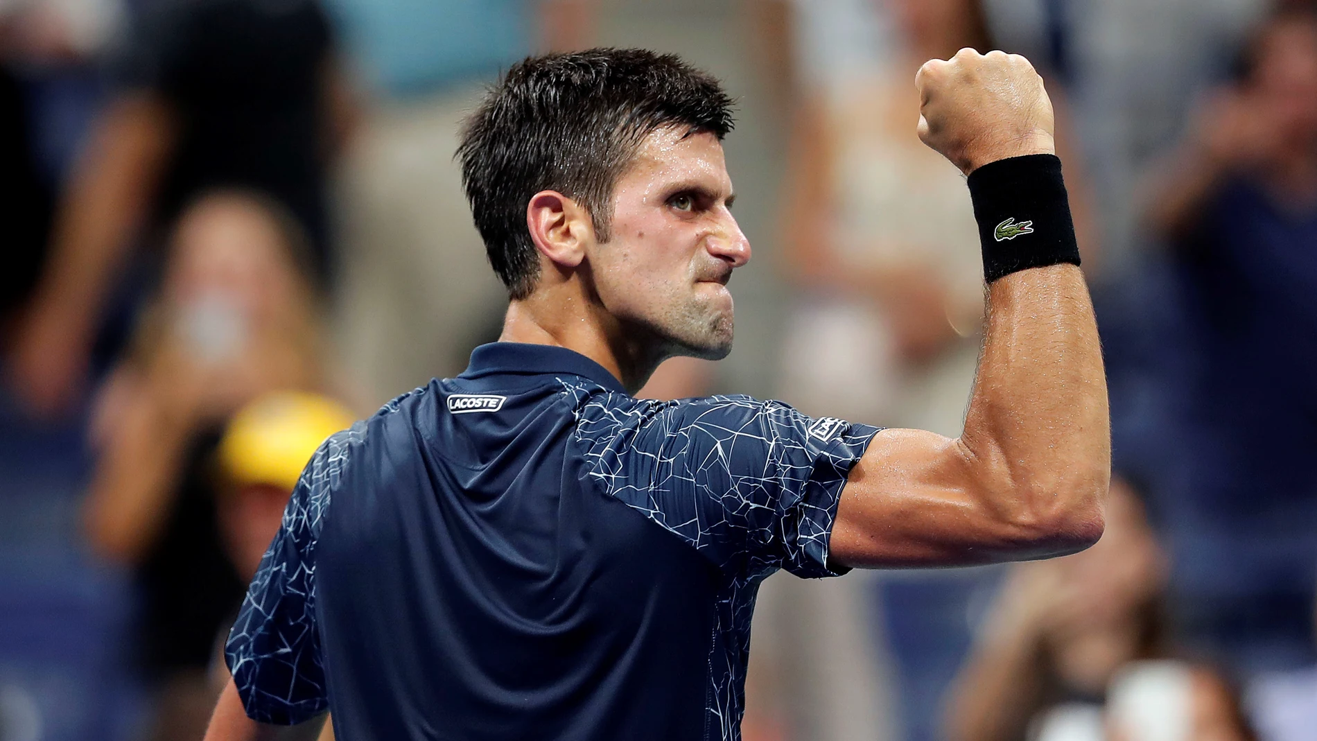 Djokovic celebra un punto contra Millman