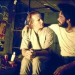 William Hurt y Raúl Julia en una escena de «El beso de la mujer araña»
