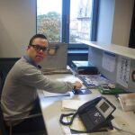 Andrés, un joven de Burgos con síndrome de Down, en su puesto de trabajo en el Instituto Municipal de Cultura