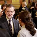 El presidente del Gobierno y candidato del PP a la reelección, Mariano Rajoy, y el líder y candidato de Podemos, Pablo Iglesias, a su llegada a la recepción