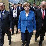 El presidente suizo Johann Schneider-Ammann, el presidente francés François Hollande y la canciller alemana Angela Merkel asisten a la ceremonia de inauguración