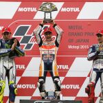 Dani Pedrosa celebra su triunfo junto a Valentino Rossi y Jorge Lorenzo
