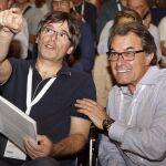 El presidente de la Generalitat, Carles Puigdemont y su antecesor Artur Mas
