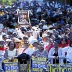 Participantes de la marcha que conmemoró ayer en Washington la celebrada en 1963