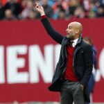 Bayern head coach Pep Guardiola of Spain gestures during a German first division Bundesliga soccer match between 1.FC Nuremberg and Bayern Munich in Nuremberg, Germany, Saturday, Feb. 8, 2014. (AP Photo/Michael Probst)