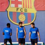 Piqué con Rakitic, en un entrenamiento