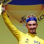 [2019 - Deceuninck-Quick Step rider Julian Alaphilippe of France celebrates on the podium, wearing]