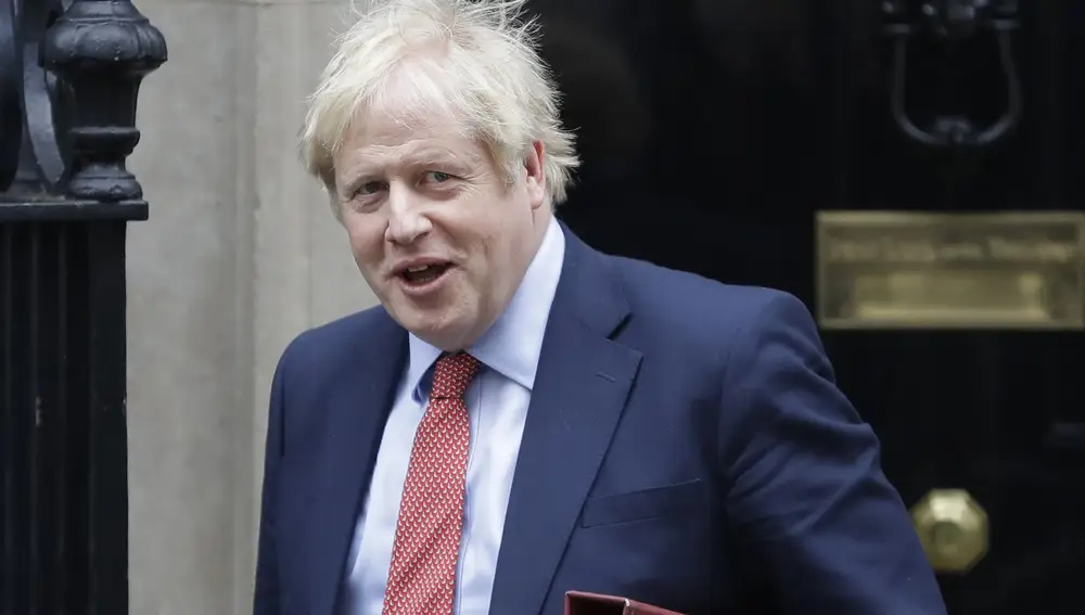 Britain's Prime Minister Boris Johnson leaves 10 Downing Street to attend the weekley session of Prime Ministers Questions in Parliament in London, Wednesday, Jan. 22, 2020. (AP Photo/Kirsty Wigglesworth)
