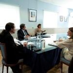 El vicepresidente segundo del Ejecutivo, Pablo Iglesias (i), junto a la ministra de Trabajo, Yolanda Díaz (d); y el ministro de Inclusión, Seguridad Social y Migraciones, José Luis Escrivá (c)