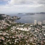 FILE - This Sept. 20, 2013 file photo shows an aerial view of the Pacific resort city of Acapulco, Mexico. The Mexican coastal city pulled a pair of controversial video ads Thursday, Aug. 6, 2020, touting the faded resortâ€™s reputation as an â€œanything goesâ€ tourism destination because they weren't appropriate during the new coronavirus pandemic. (AP Photo/Eduardo Verdugo, File)
