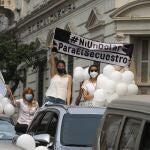 People participate in a caravan to demand the release of former vice-president Oscar Denis and farmworker Adelio Mendoza, who were kidnapped Wednesday by the Paraguayan People's Army rebels, in Asuncion, Paraguay, Sunday, Sept. 13, 2020. Denis, a member of Liberal Radical Authentic Party, was vice president for six months in 2012. (AP Photo/Jorge Saenz)