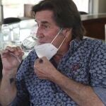 Johnny Schuler, a Pisco producer and owner of La Caravedo vineyard, tests his Porton Pisco brand at his office in the desert city of Ica, Peru, Monday, Sept. 28, 2020. More than 500 Pisco producers have seen their sales collapse by half and thousands of grape growers have had their fields ruined because of the late harvests, because of the strict lockdown implemented to stop COVID-19. (AP Photo/Martin Mejia)